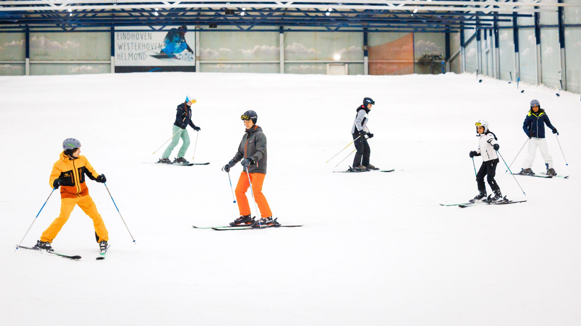 Indoor skiing on real snow. Students follow from the ski instructor during ski lessons.